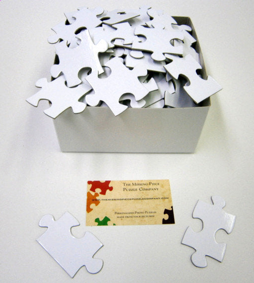 White Puzzle Pieces in a variety of piece counts. The Missing Piece Puzzle Company