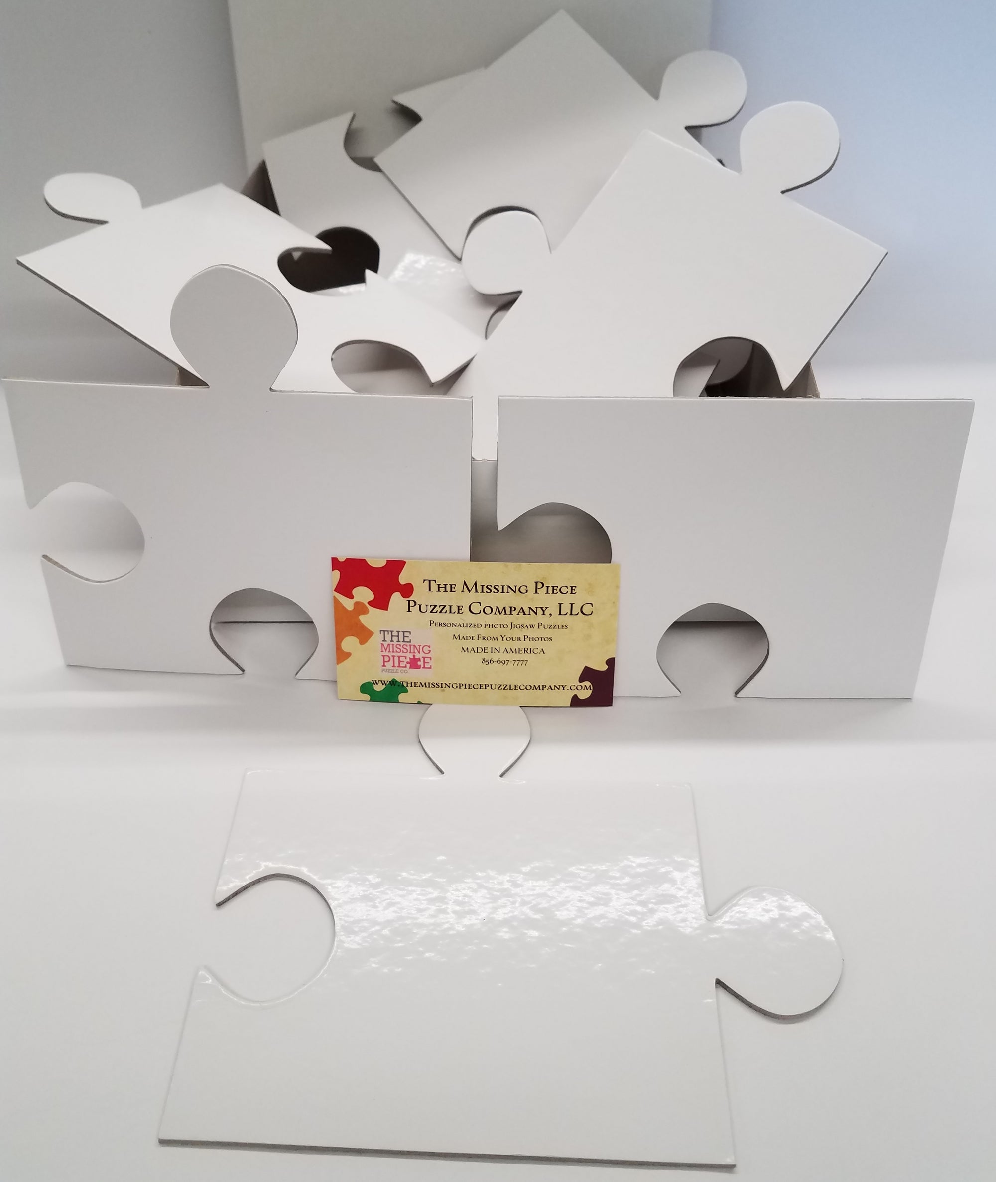 White Puzzle Pieces in a variety of piece counts. The Missing Piece Puzzle Company