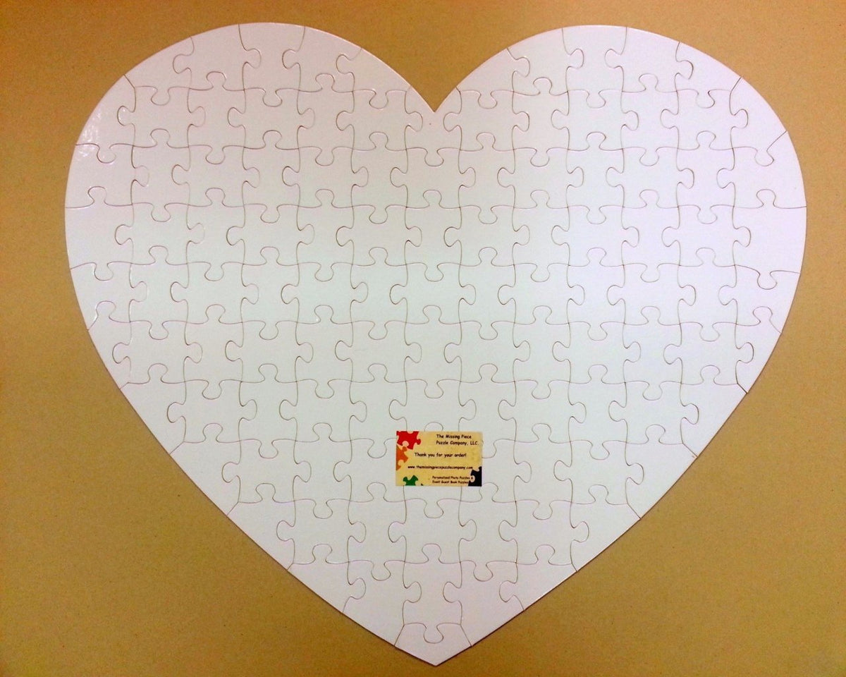 Giant-Heart-Shaped-Guest-Book-Puzzle-with-White-Puzzle-Pieces The-Missing-Piece-Puzzle-Company