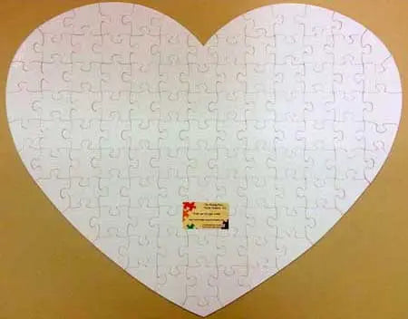 heart shaped blank puzzle with 76 extra large white puzzle pieces