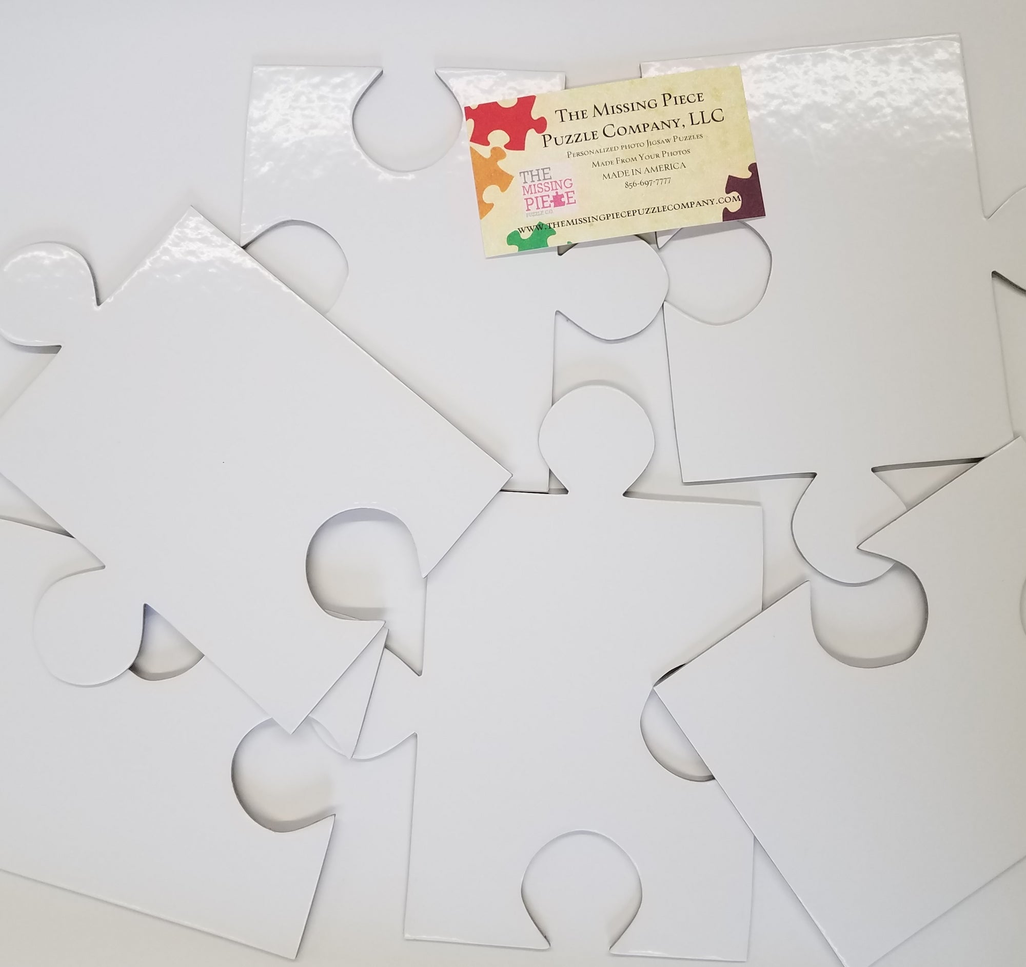 White Puzzle Pieces in a variety of piece counts. The Missing Piece Puzzle Company