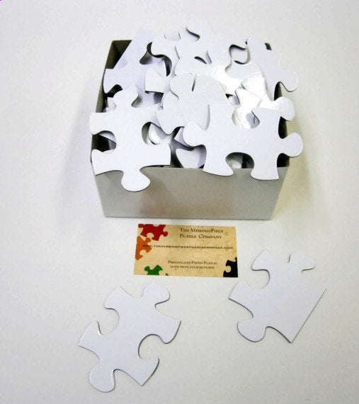 White Puzzle Pieces in a variety of piece counts. The Missing Piece Puzzle Company