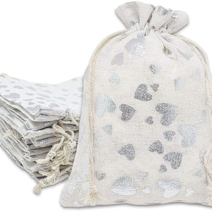 Add A Gift Bag.  white jute gift bag with silver hearts from The Missing Piece Puzzle Company